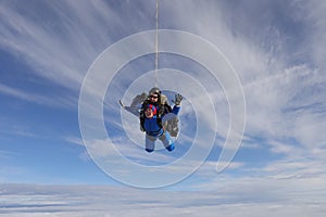 Skydiving. Tandem jump. Two people are in the sky.