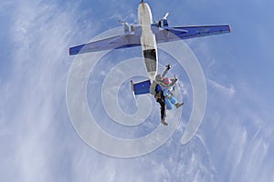 Skydiving. Tandem jump. Two people are in the sky.