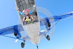 Skydiving. Tandem jump. Two skydivers are in the sky.
