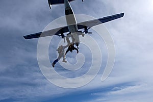 Skydiving. Two skydivers are flyingin the sky.