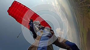 Skydiving video. Skidiver piloting a parachute.