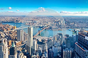 Skyline aerial view of Manhattan with skyscrapers, East River, Brooklyn Bridge and Manhattan Bridge - New York, USA