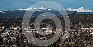 Skyline of Bend Oregon with Cascade Mountains photo