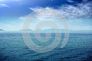 Skyline of Blue Seascape with mountains and Blue sky