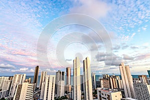 Skyline Buildings in a Pink Sky Sunset day at Boa Viagem Beach, Recife, Pernambuco, Brazil photo