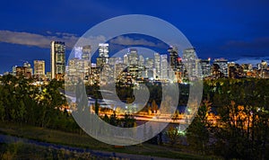 Skyline of Calgary with Bow River in Canada at night