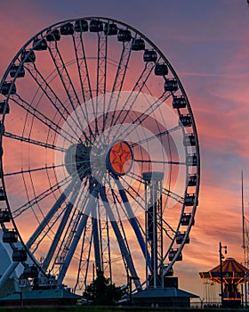 The skyline of Chicago, Illinois, illuminated by the lights of the Ferris wheel at Navy Pier