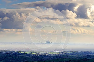 Skyline of the city of Madrid on a foggy day with huge clouds that threaten a storm