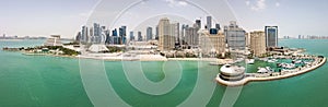 Skyline of Doha, Qatar, Persian Gulf. Modern rich middle eastern city of skyscrapers, aerial view in good weather, view of marina.