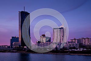 Skyline of Donau City Vienna in Austria with the DC Tower against a purple sky