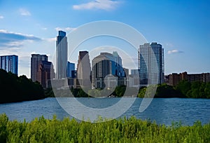 The skyline of downtown Austin Texas from the boardwalk on Lady Bird Lake