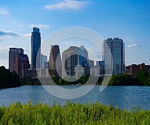 The skyline of downtown Austin Texas from the boardwalk on Lady Bird Lake