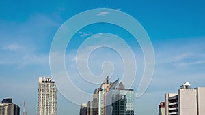 Skyline Downtown Bangkok capital city of Thailand in blue sky sunny day. tall building in blue clear sky in day time. aerial view