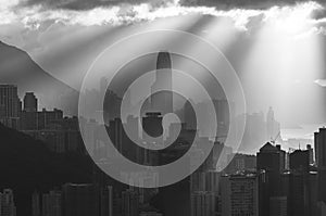 Skyline of downtown of Hong Kong city with sun ray under sunset