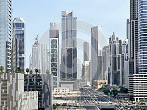 Skyline of Dubai illuminated by the towering skyscrapers that line the bustling street
