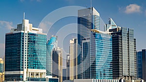 Skyline of Dubai's business bay with skyscrapers at day time timelapse.