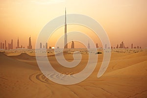 Skyline of Dubai at sunset or dusk, view from Arabian Desert