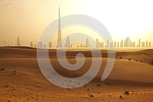 Skyline of Dubai at sunset or dusk, view from Arabian Desert