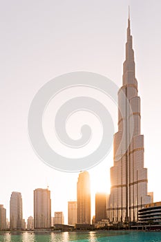 The skyline of Dubai at sunset in front of the Burj Khalifa