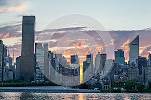 Skyline of the east side of midtown Manhattan at sunset