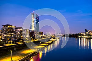 The skyline of Frankfurt, Germany, with the European Central Bank tower at night - All logos and brands removed