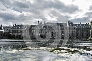 Skyline of The Hague with the modern office buildings behind the Mauritshuis museum and the Binnenhof parliament building next to