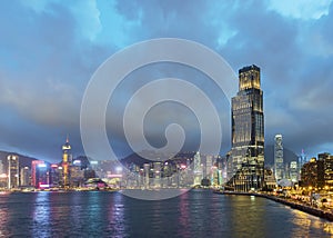 Skyline and harbor of Hong Kong city at dusk