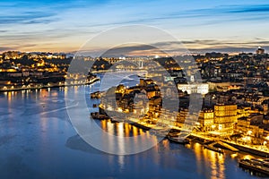 Skyline of the historic city of Porto with famous bridge at night, Portugal