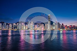 Skyline Hong Kong city at twilight time view from harbor in Hong Kong