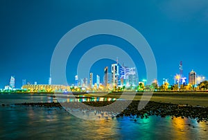 Skyline of Kuwait including the Seif palace, Liberation tower and the National assembly building during night....IMAGE