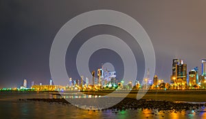 Skyline of Kuwait including the Seif palace, Liberation tower and the National assembly building during night....IMAGE