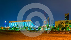 Skyline of Kuwait with the National assenbly building and the Liberation tower during night....IMAGE