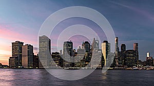 Skyline of lower Manhattan during the twilight seen from Brooklyn Bridge Park, New York