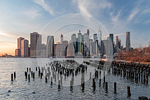 Skyline of lower Manhattan during a winter sunset as seen from Brooklyn Bridge Park, New York