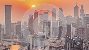 Skyline with modern architecture of Dubai business bay towers at sunset . Aerial view