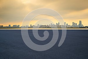 The skyline of modern urban architecture and the scenery of Asphalt road in Suzhou, Jiangsu Province, China