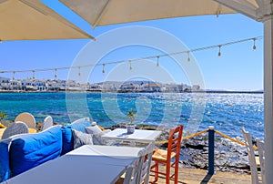 Skyline of the Mykonos town in Greece: view of the harbor from a typical restaurant on the seashore.