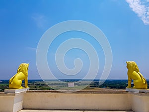 Skyline of odisa and golden lion statues at theview point of dhauli shanti stupa at odisha,India