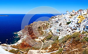 Skyline of Oia, traditional white architecture with windmills, greek village of Santorini, Greece. Santorini is island