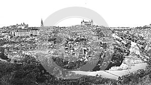 Skyline of the old city of Toledo on the hill where the Old Cathedral and the Alcazar stand embraced by the Tagus River in