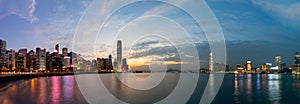Skyline panorama of Colorful magnificent sunset city view of Central and kowloon on both sides of Victoria Harbour, Hong Kong,