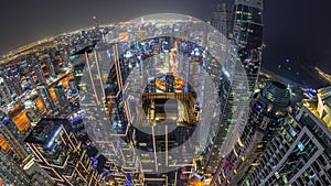 Skyline panorama of Dubai Marina showing canal surrounded by skyscrapers along shoreline night timelapse. DUBAI, UAE