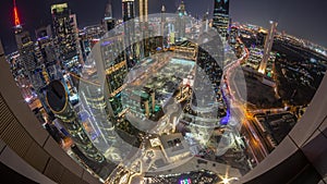 Skyline panorama of the high-rise buildings on Sheikh Zayed Road in Dubai aerial day to night timelapse, UAE.