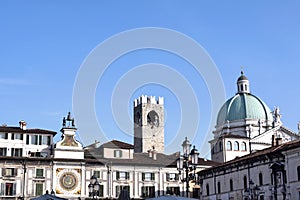 Skyline of Piazza della Loggia in Brescia with the dome of the C