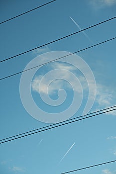 Skyline with Power Lines and Contrail photo