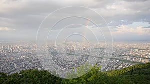 Skyline, rainbow, lover locks and satelite from top of mountain Moiwa, Hokkaido, Japan