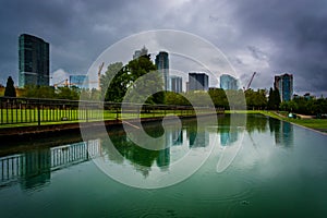 The skyline reflecting in a pond, at Downtown Park, in Bellevue, Washington.