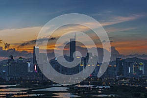 Skyline of Shenzhen city, China at dusk. Viewed from Hong Kong border