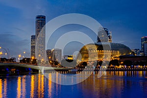 The skyline of Singapore at sunset with the Esplanade theathre