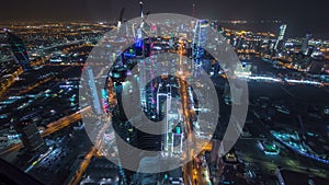 Skyline with Skyscrapers night timelapse in Kuwait City downtown illuminated at dusk. Kuwait City, Middle East